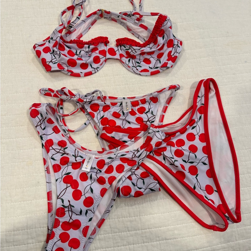 Cherry Print  Swim Set.  Light purple and red.   I top and 3 bottoms.